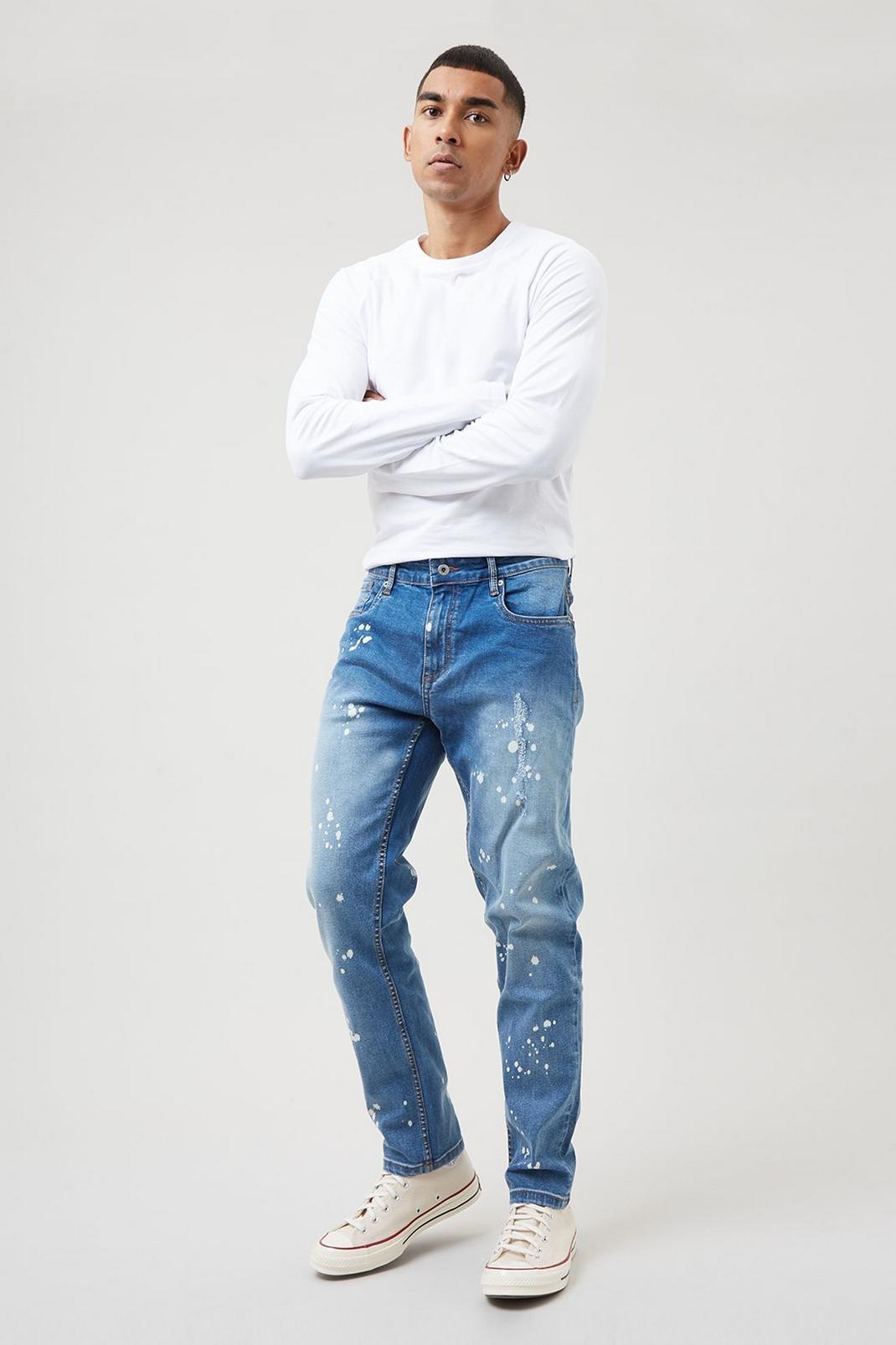 564 Slim Bleach Paint Splatter Jeans image number 1