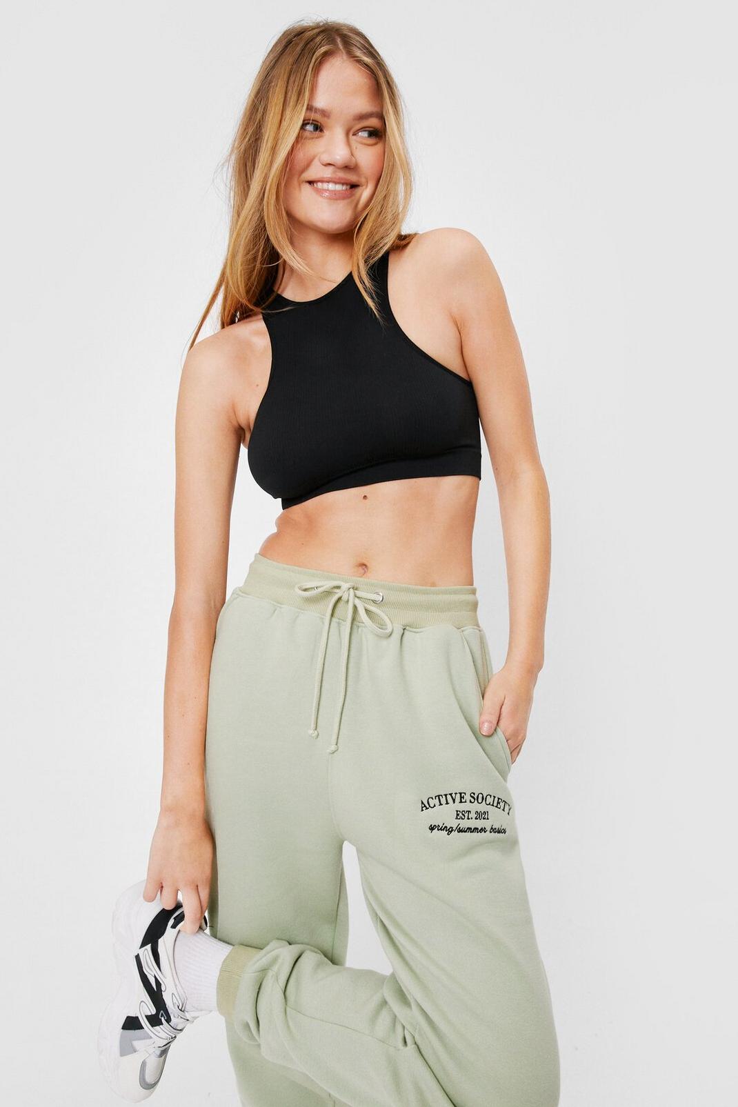 Olive Active Society Embroidered Graphic Joggers image number 1