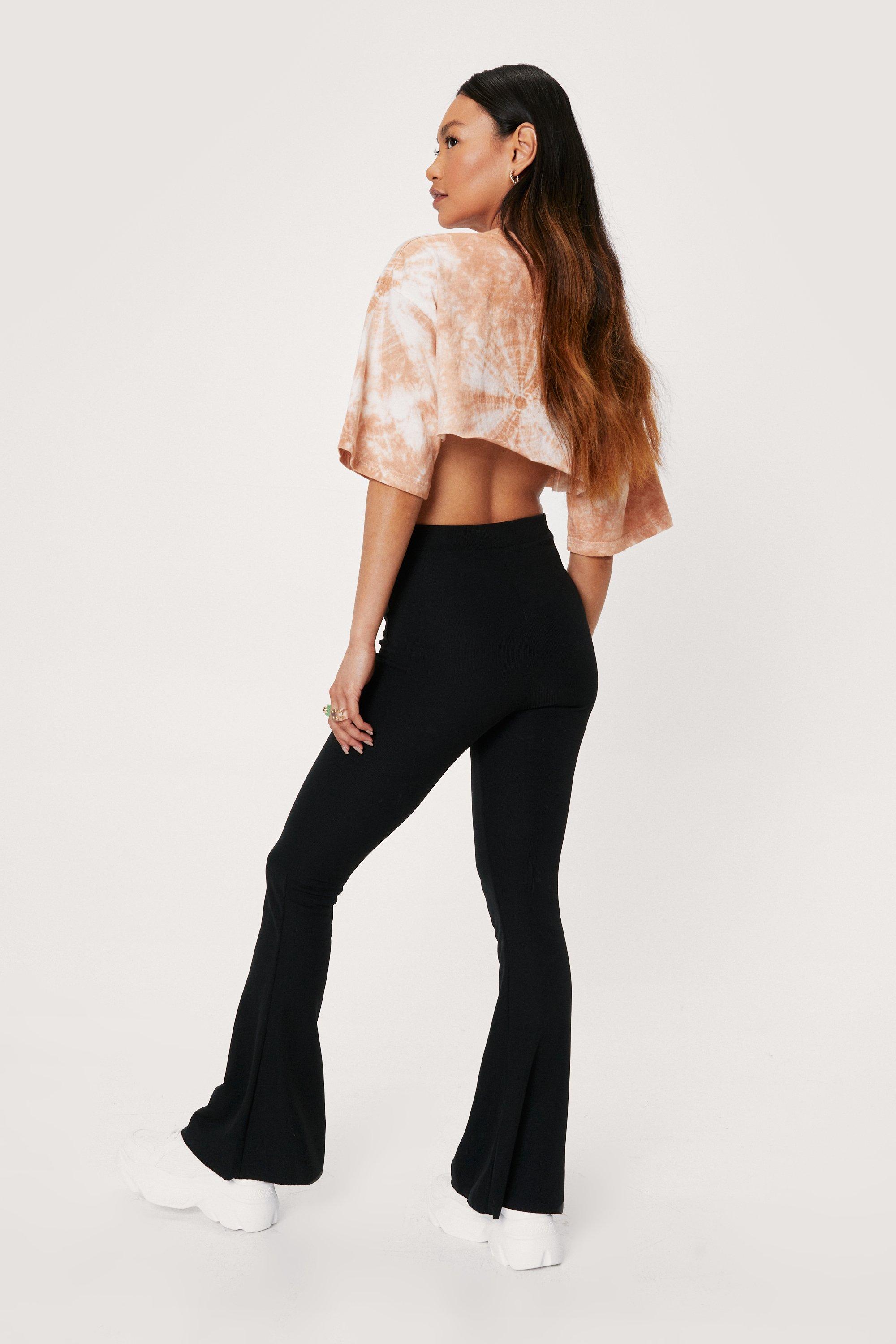 https://media.nastygal.com/i/nastygal/agg05791_black_xl_3/petite-ribbed-lettuce-hem-flared-trousers