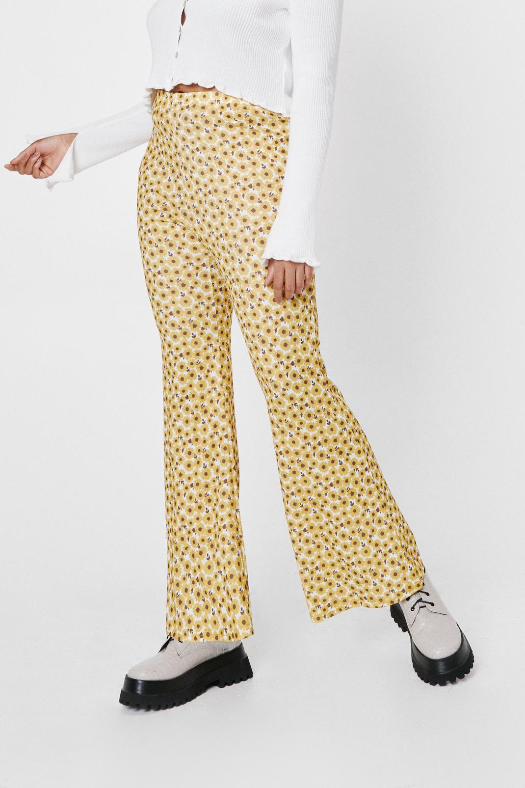 Yellow Plus Size Daisy Print High Waisted Flare Pants image number 1