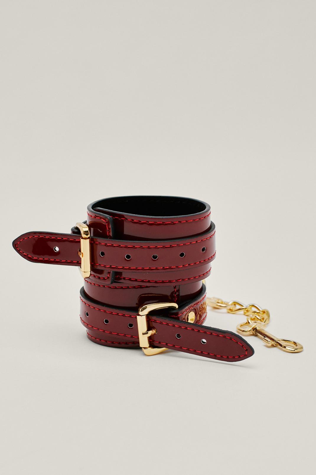 Red Patent Restraint Chain Detail Hand Cuffs image number 1