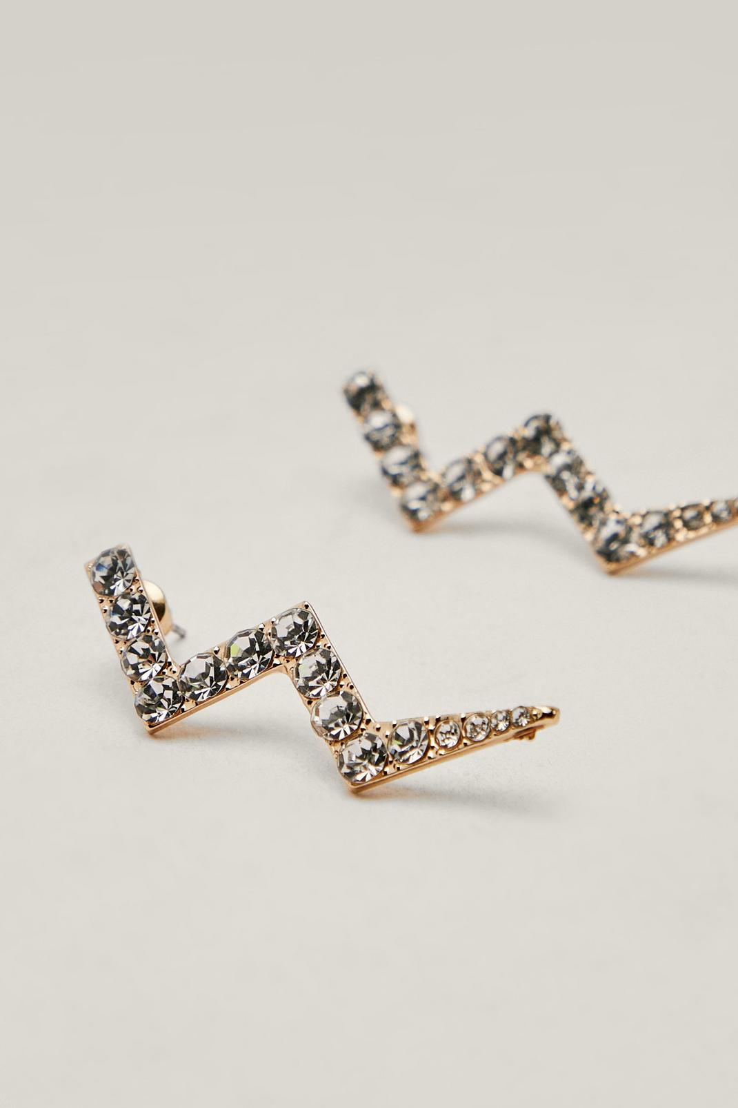 Gold Metal Diamante Lightning Bolt Earrings image number 1