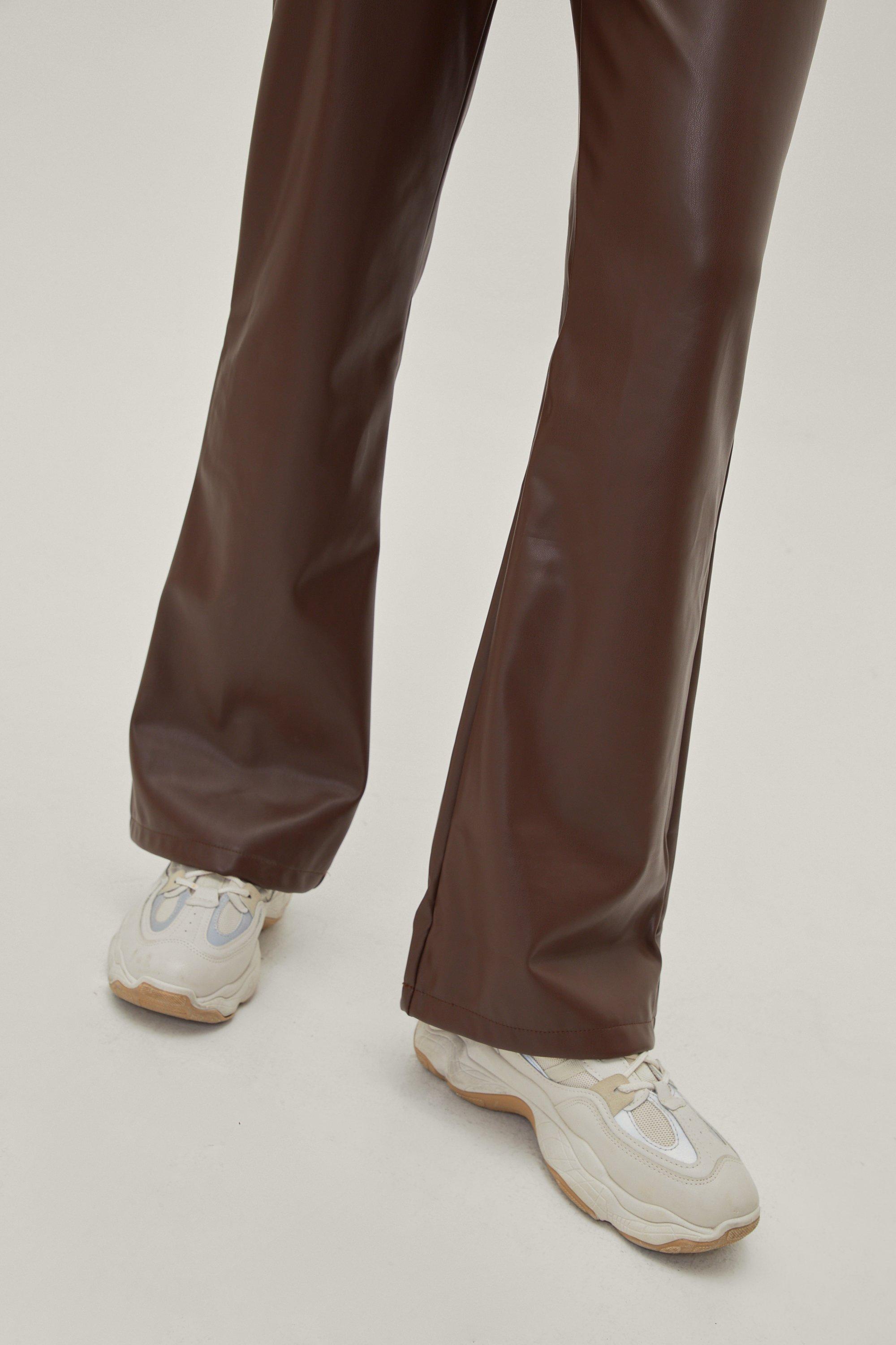 Low-rise flared faux leather pants in brown - Rotate