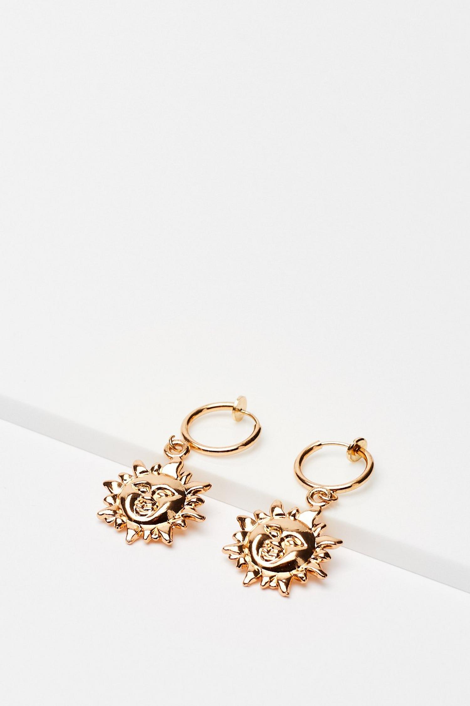 Boucles d'oreilles pendantes à soleils | Nasty Gal