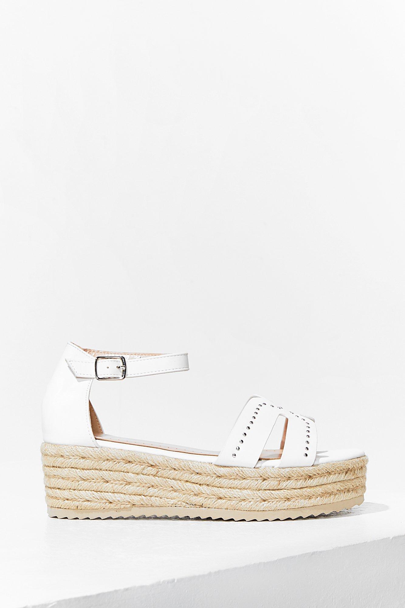 white studded flatforms
