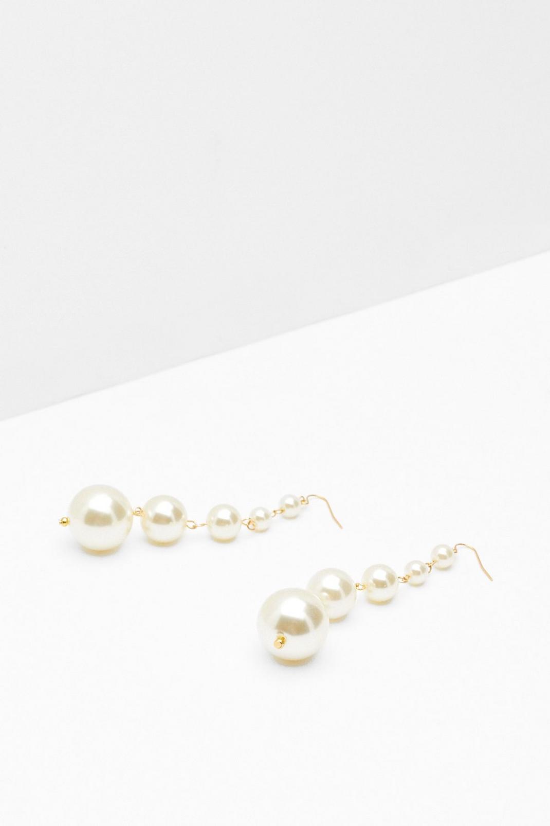 Boucles d'oreilles pendantes à perles image number 1