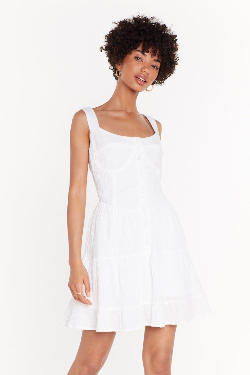 white dress with frill hem