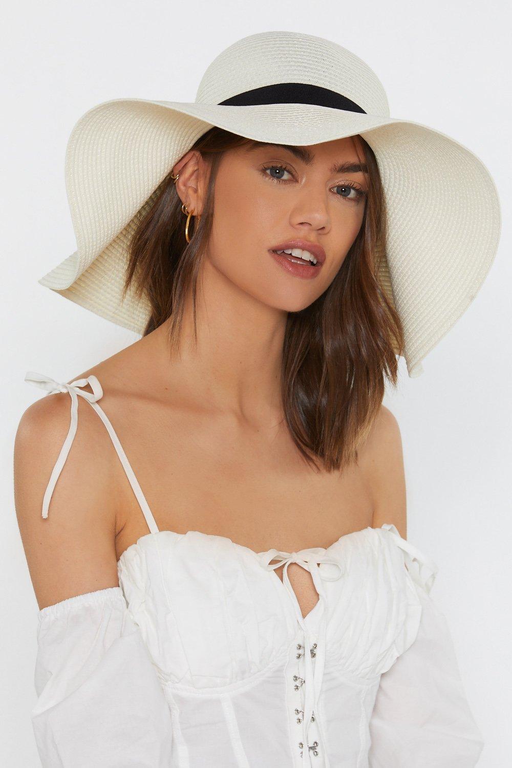 oversized white floppy hat