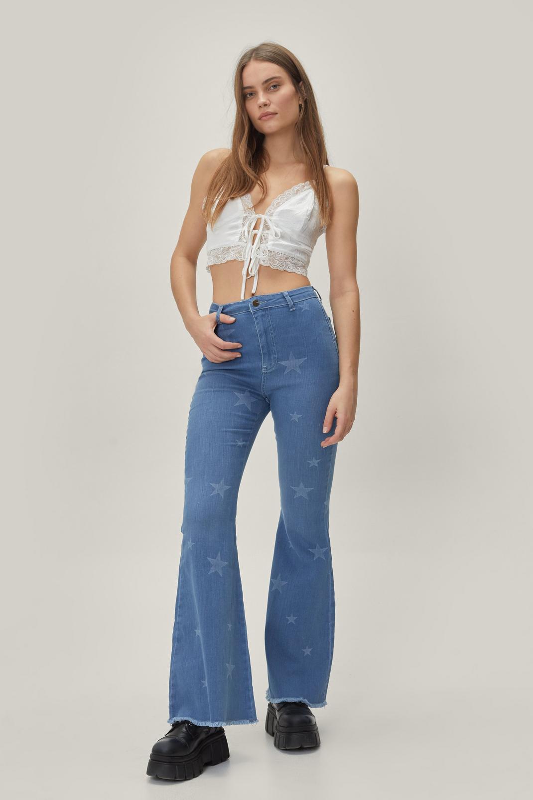 Blue High Waisted Star Print Flare Jeans image number 1