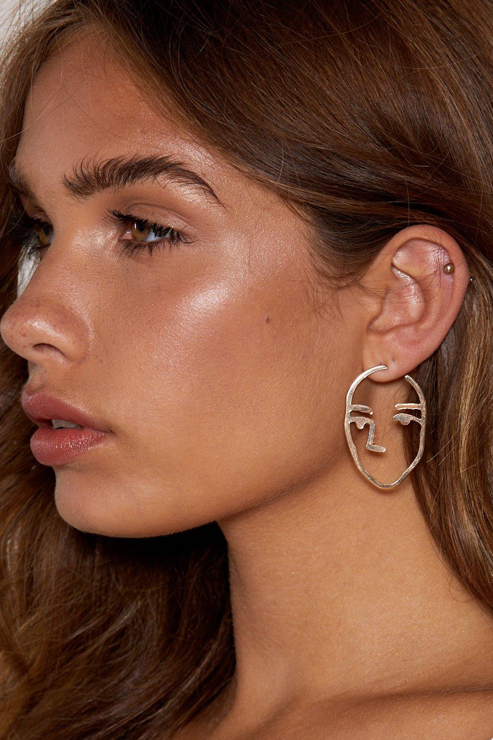 Face earrings on sale