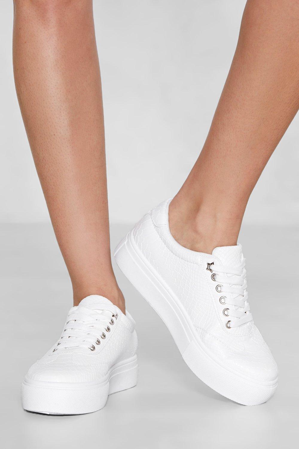 white faux leather slip on sneakers