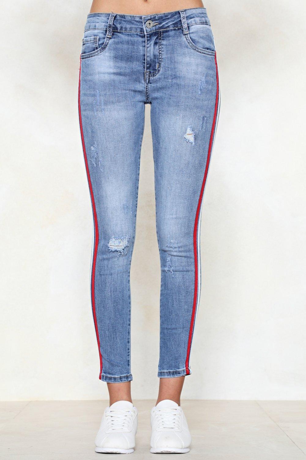 Jeans with red and store white stripe on the side