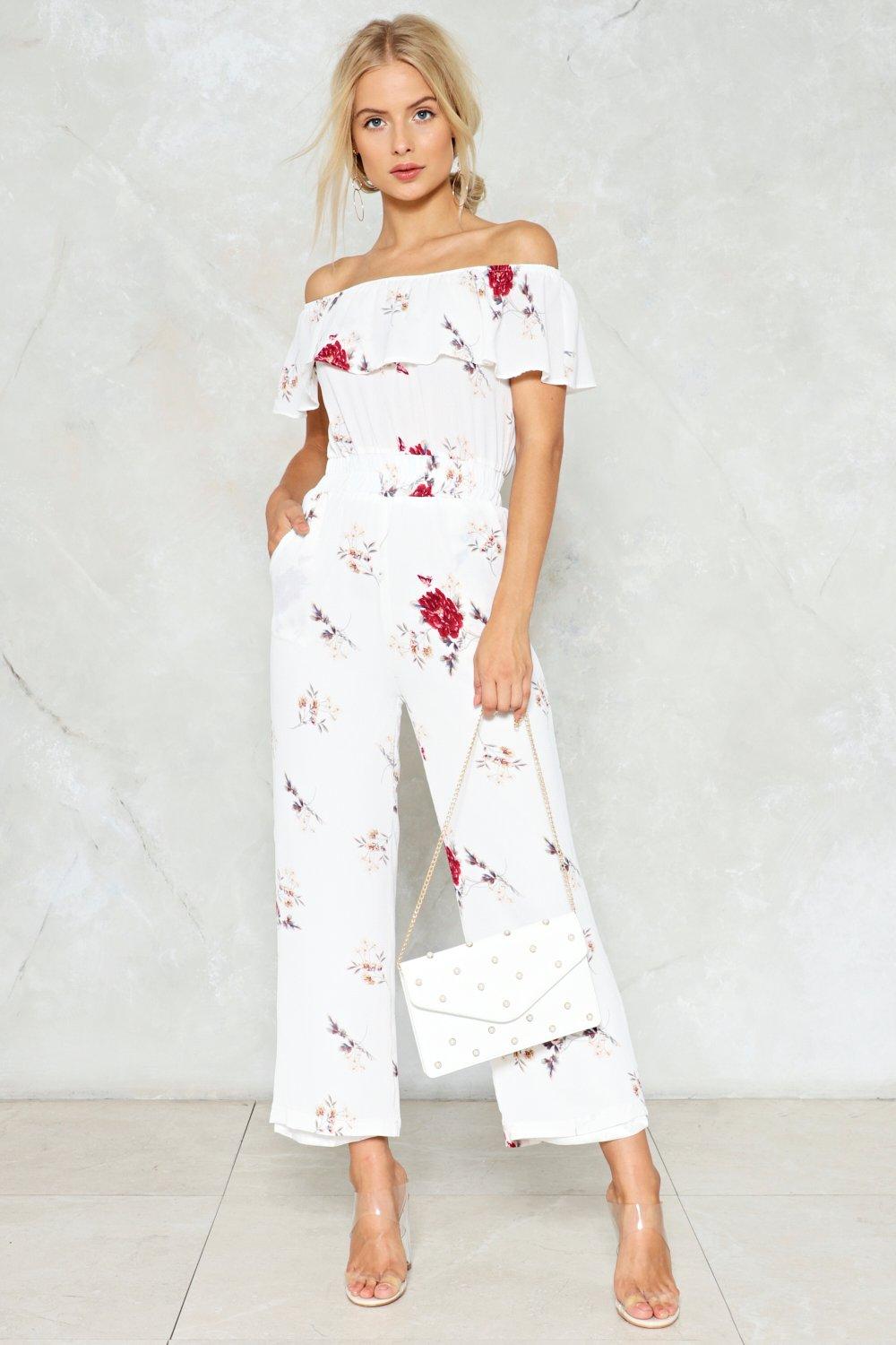 white jumpsuit with flowers