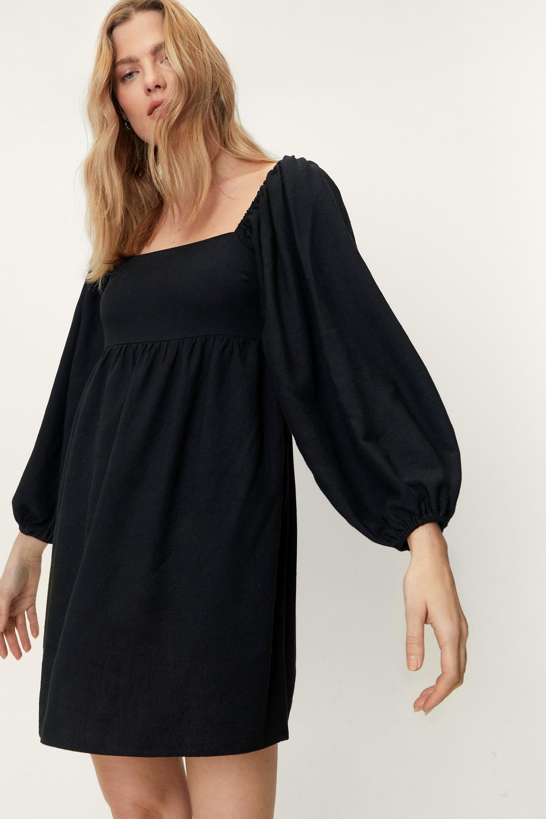 Black Linen Smocked Babydoll Long Sleeve Mini Dress image number 1