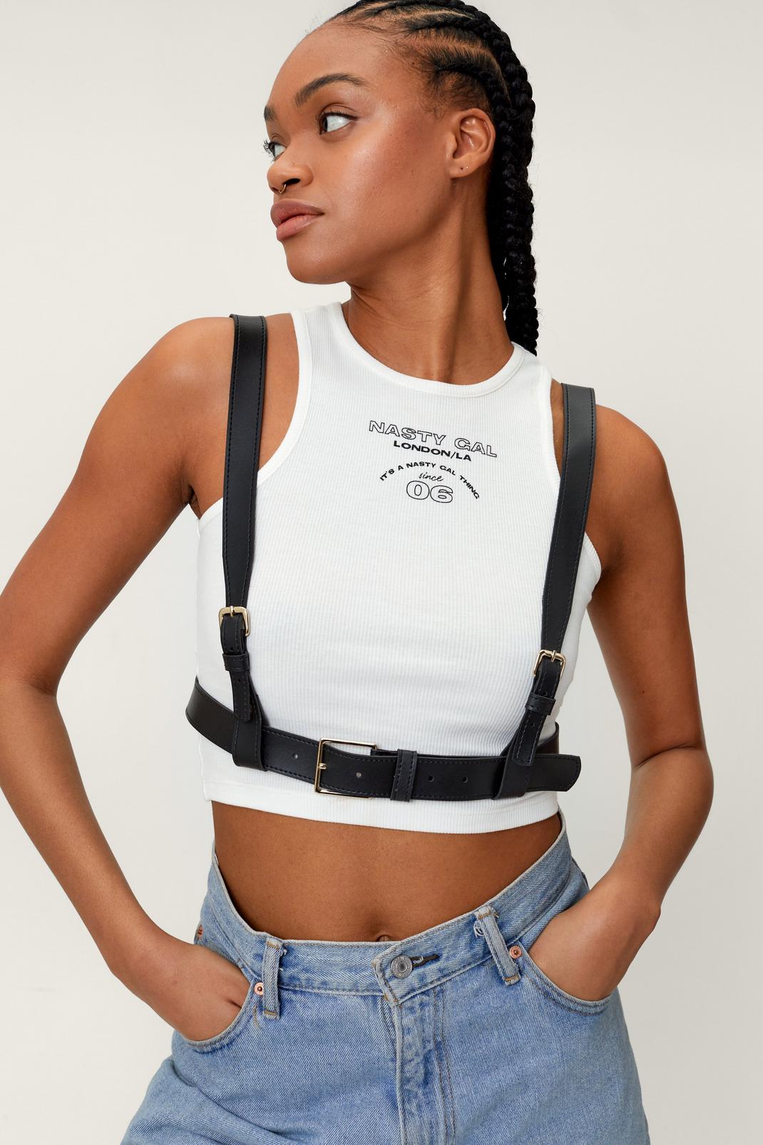 https://media.nastygal.com/i/nastygal/bgg05016_black_xl/female-black-faux-leather-buckle-harness-belt/?w=1070&qlt=default&fmt.jp2.qlt=70&fmt=auto&sm=fit