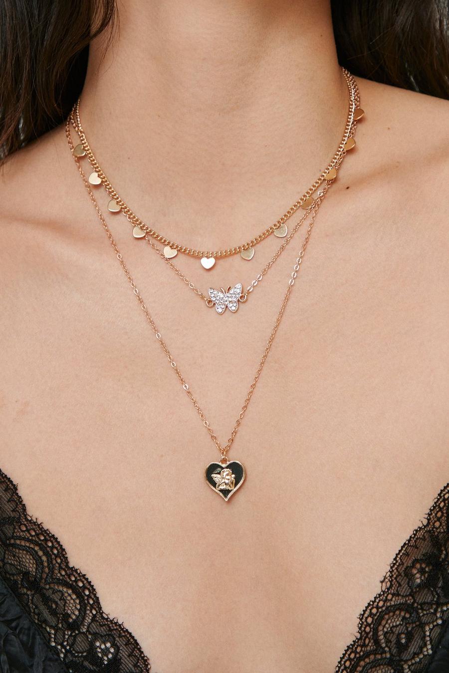 Collier triple chaîne avec pendentifs cœur et papillon