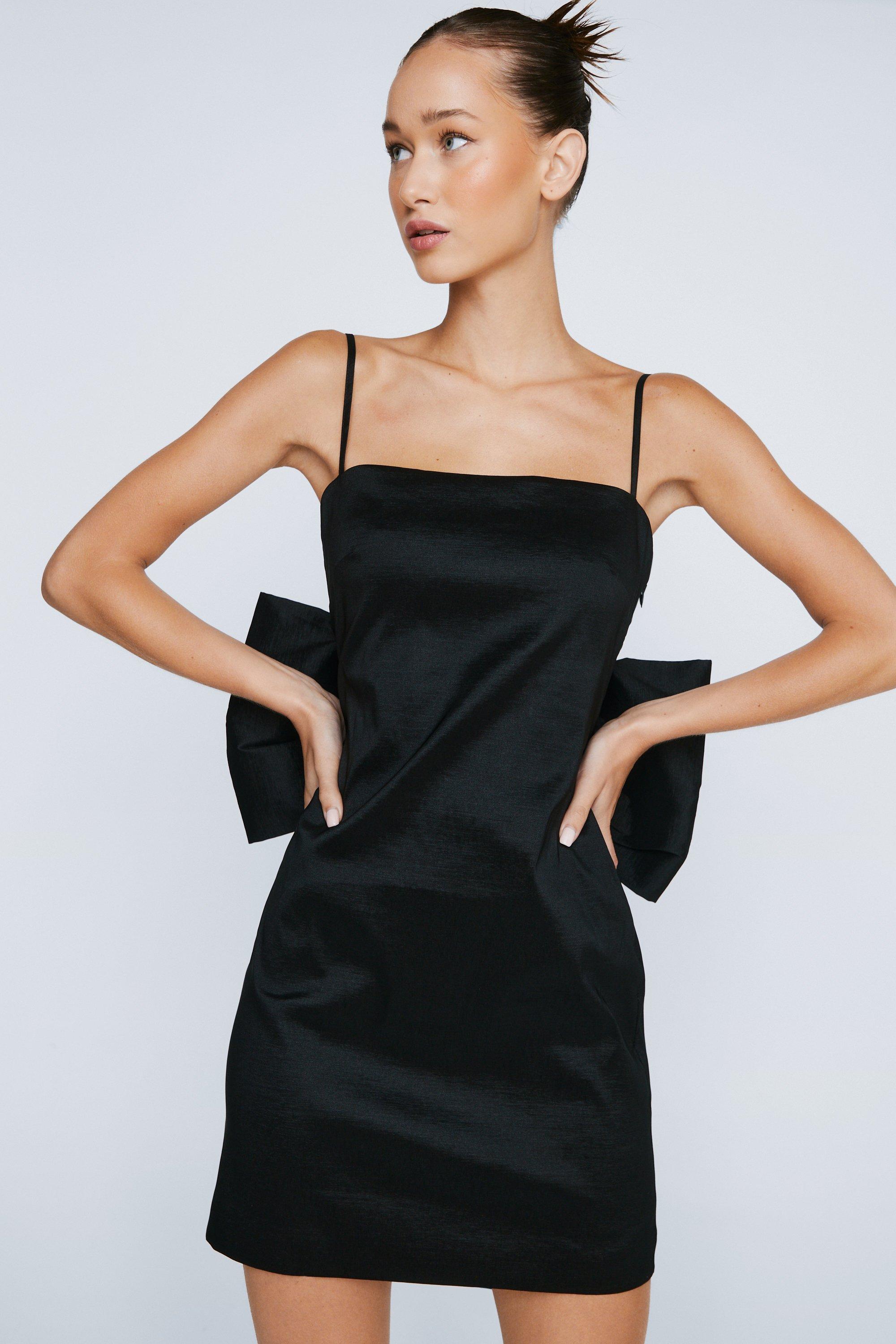 https://media.nastygal.com/i/nastygal/bgg13668_black_xl_1/petite-taffeta-bow-back-mini-dress