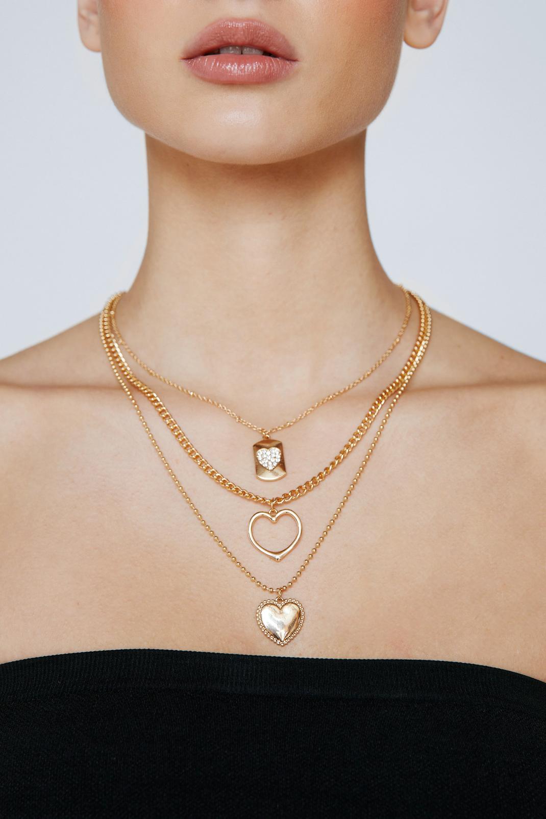 Gold Triple Layered Heart Pendant Necklace image number 1