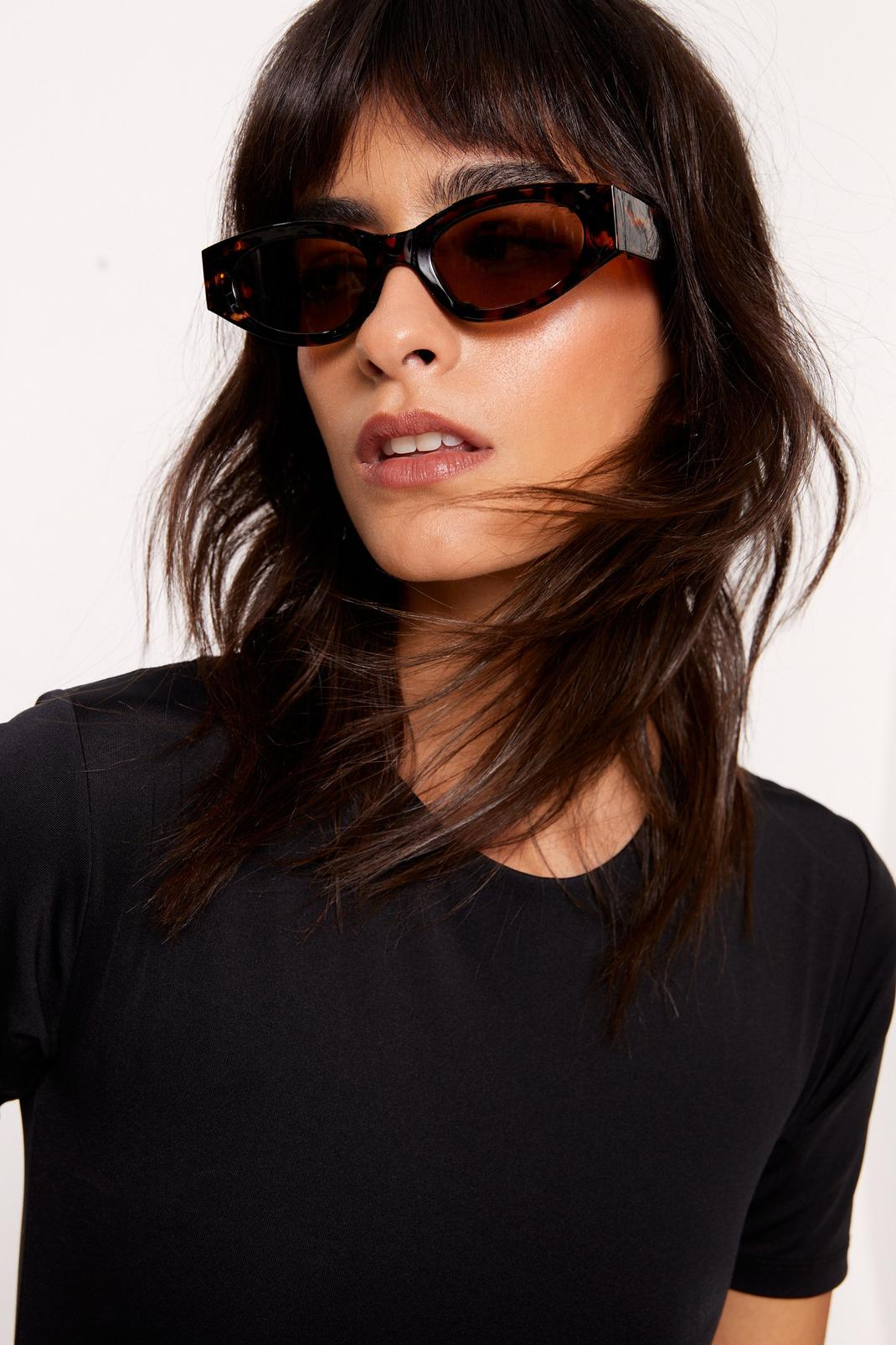 Brown Tortoise Shell Wide Frame Sunglasses image number 1