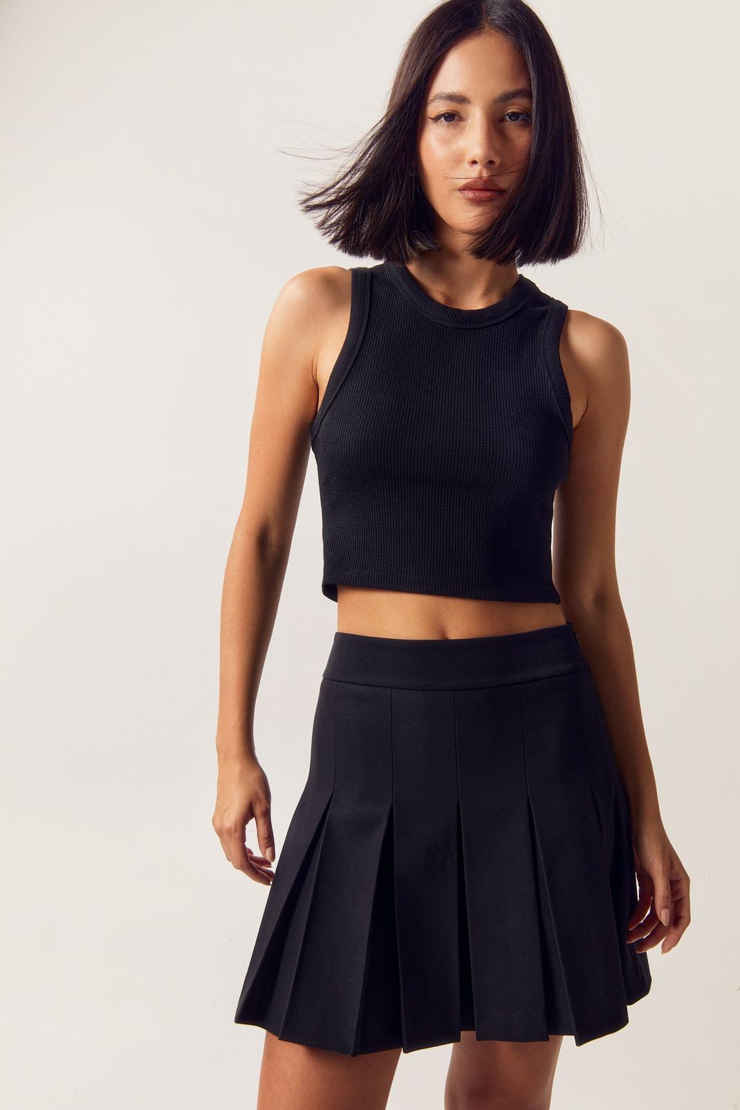 https://media.nastygal.com/i/nastygal/bgg17683_black_xl/female-black-tailored-pleated-mini-skirt/?w=1070&qlt=default&fmt.jp2.qlt=70&fmt=auto&sm=fit