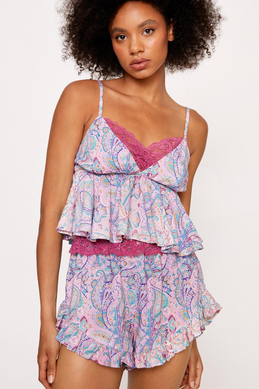 https://media.nastygal.com/i/nastygal/bgg18203_pale%20pink_xl/female-pale%20pink-paisley-lace-trim-ruffle-camisole-and-shorts-pajama-set/?w=1070&qlt=default&fmt.jp2.qlt=70&fmt=auto&sm=fit