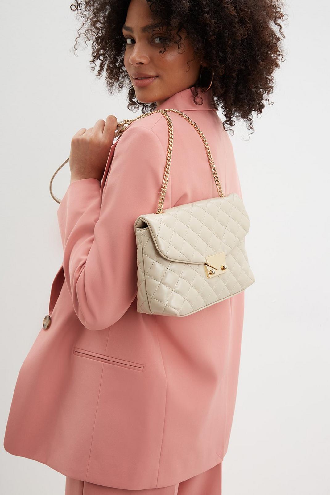 Ivory Quilted Bag With Gold Lock Detail image number 1